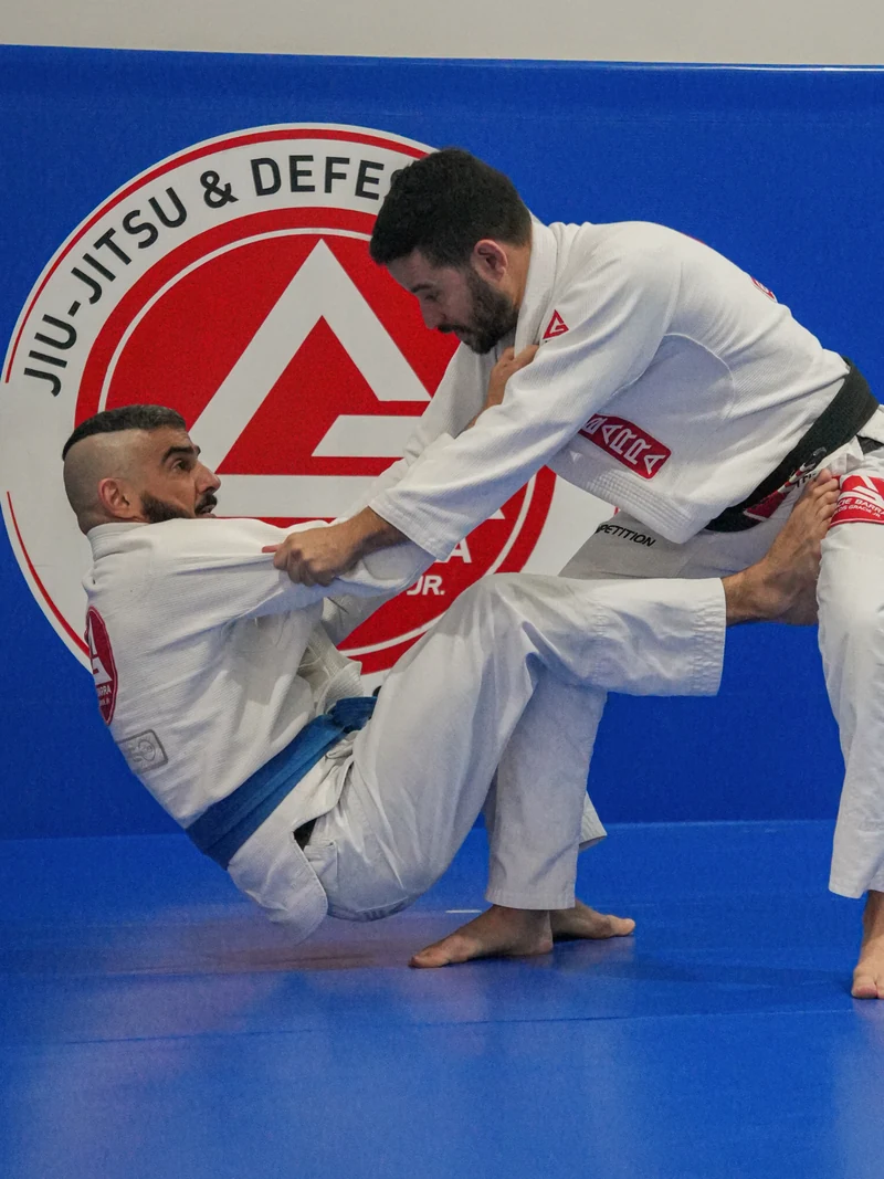 Gracie Barra students practising guard techniques