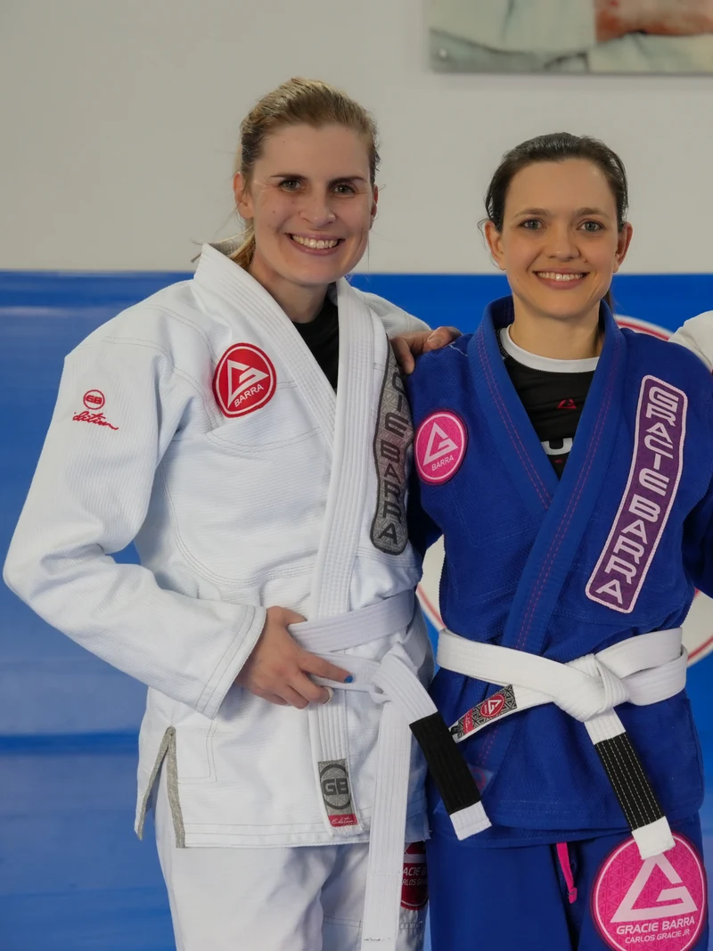 Two Gracie Barra white-belt students together after class