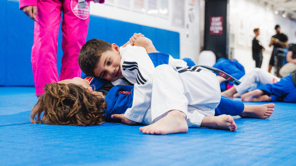 Young Brazilian Jiu‑Jitsu students in a kids Jiu‑Jitsu class